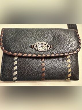 Brighton leather wallet/crossbody with whipstitching and filigree ornament.